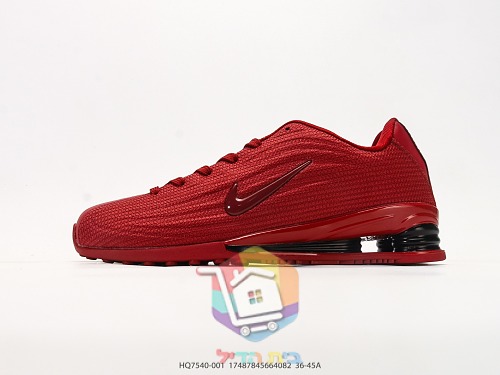 נעלי ריצה Nike Shox אדומות עם עמודי בלימה שחורים בעקב 9